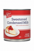 Baker's Corner Sweetened Condensed Milk 14 oz Can Front Red Banner Cheesecake Serving Suggestion